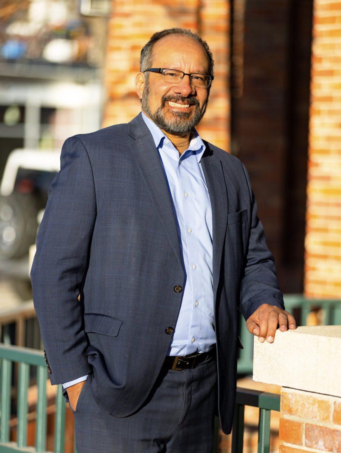 Luis A. Corchado standing outside a brick building